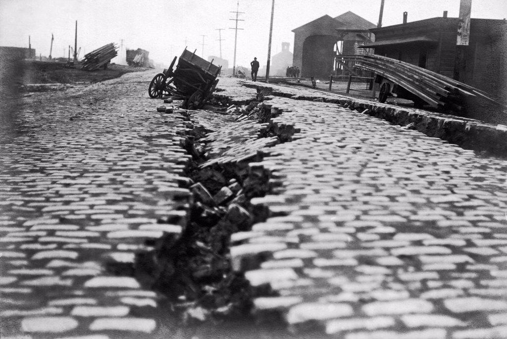 SAN FRANCISCO, CALIFORNIA: 1906. A SPLIT ON THE NORTH END OF EAST STREET FROM THE EARTHQUAKE