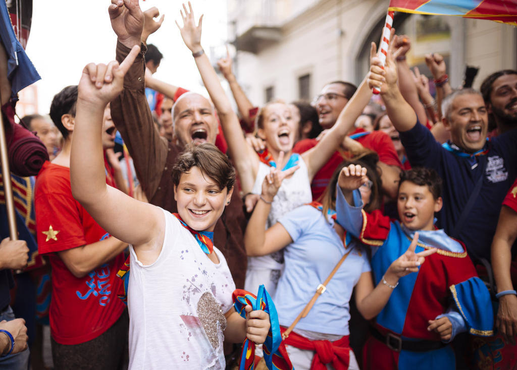 Joyful crowd celebrating a victory on the streets