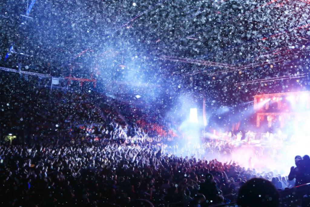 CROWD AT A ROCK CONCERT SPOTLIGHT BACKGROUND BLUR