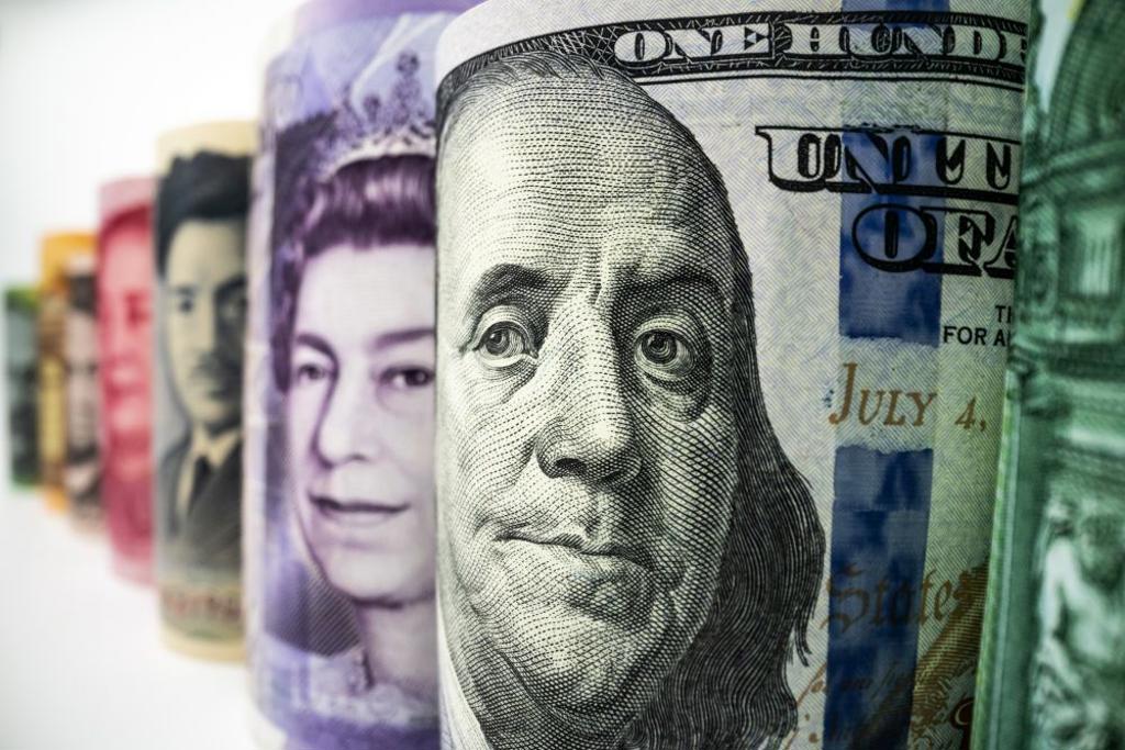 MACRO SHOT OF INTERNATIONAL CURRENCY MONEY INCLUDE US AMERICAN DOLLAR, EURO CURRENCY, BRITISH UK POUND, AUSTRALIAN DOLLAR, CHINA YUAN AND JAPAN YEN