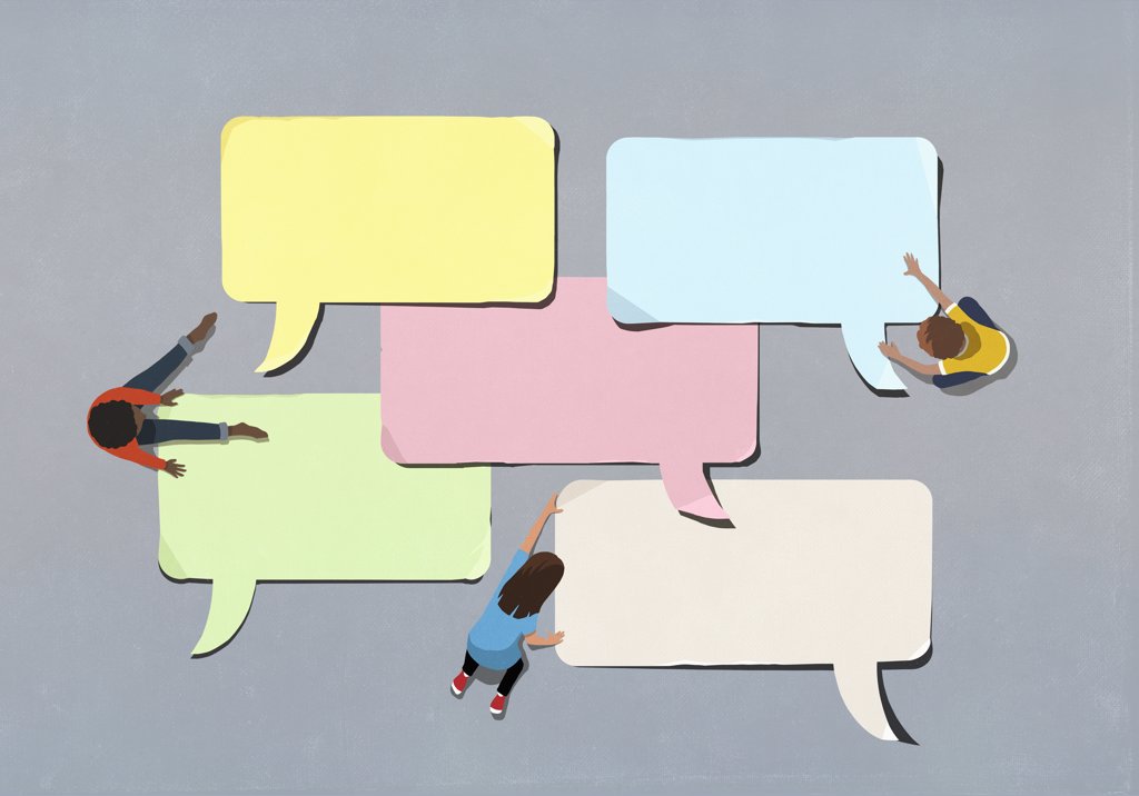 KIDS ARRANGING BLANK MULTICOLOR SPEECH BUBBLES