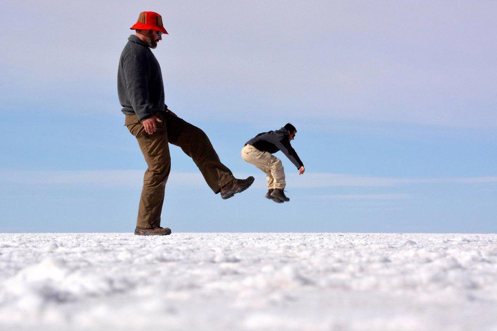 OPTICAL ILLUSION, MAN BEING KICKED