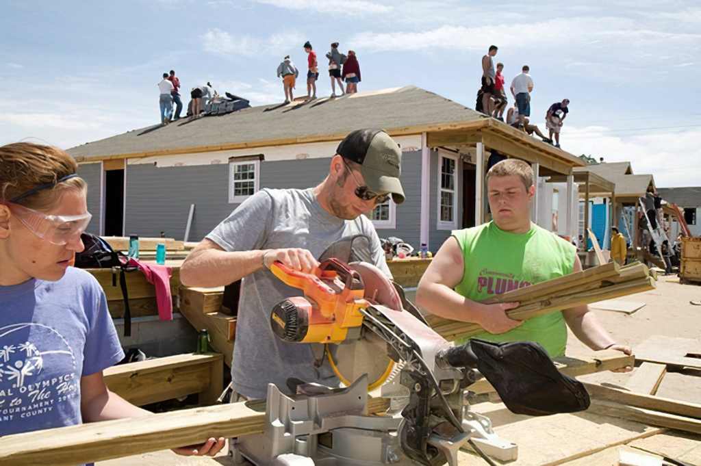 YOUNG VOLUNTEERS BUILD NEW HOUSES IN A HABITAT FOR A HUMANITY PROJECT TO REPLACE SOME OF THE HOUSING DESTROYED BY HURRICANE KATRINA