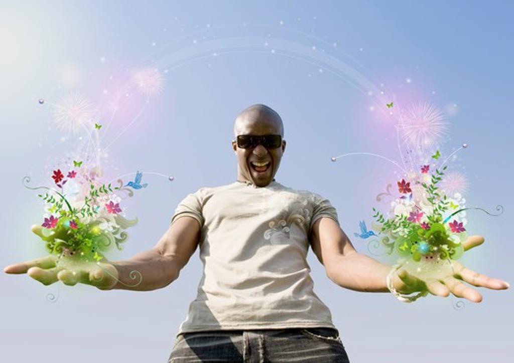 AFRICAN MAN HOLDING FLOWERS AND VINES