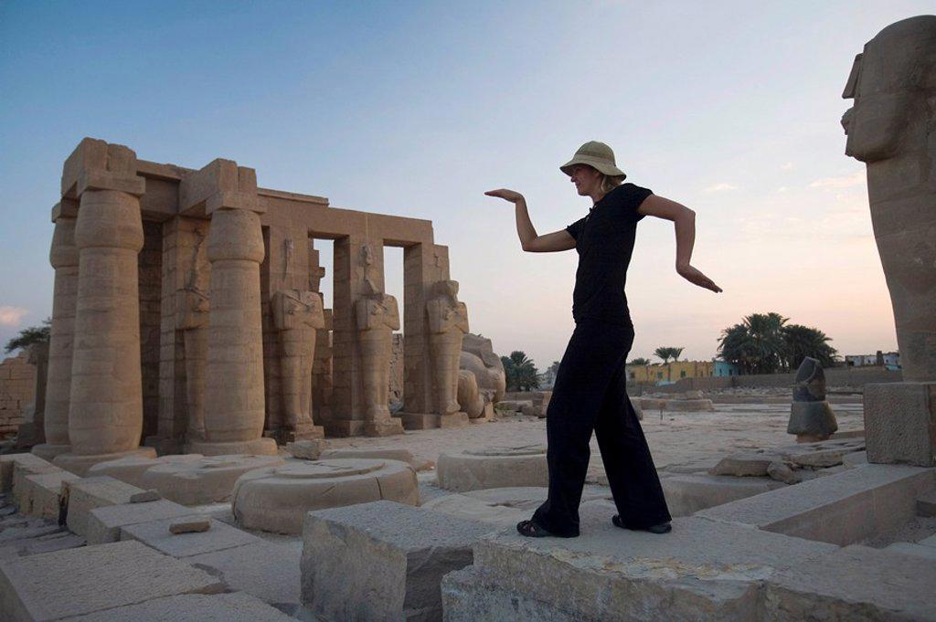 WOMAN TOURIST WALKS LIKE AN EGYPTIAN AT THE RAMESSEUM