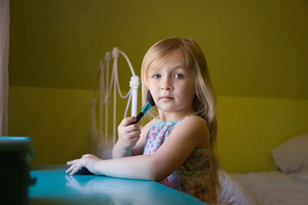 GIRL PLAYING WITH MAKE UP BRUSH