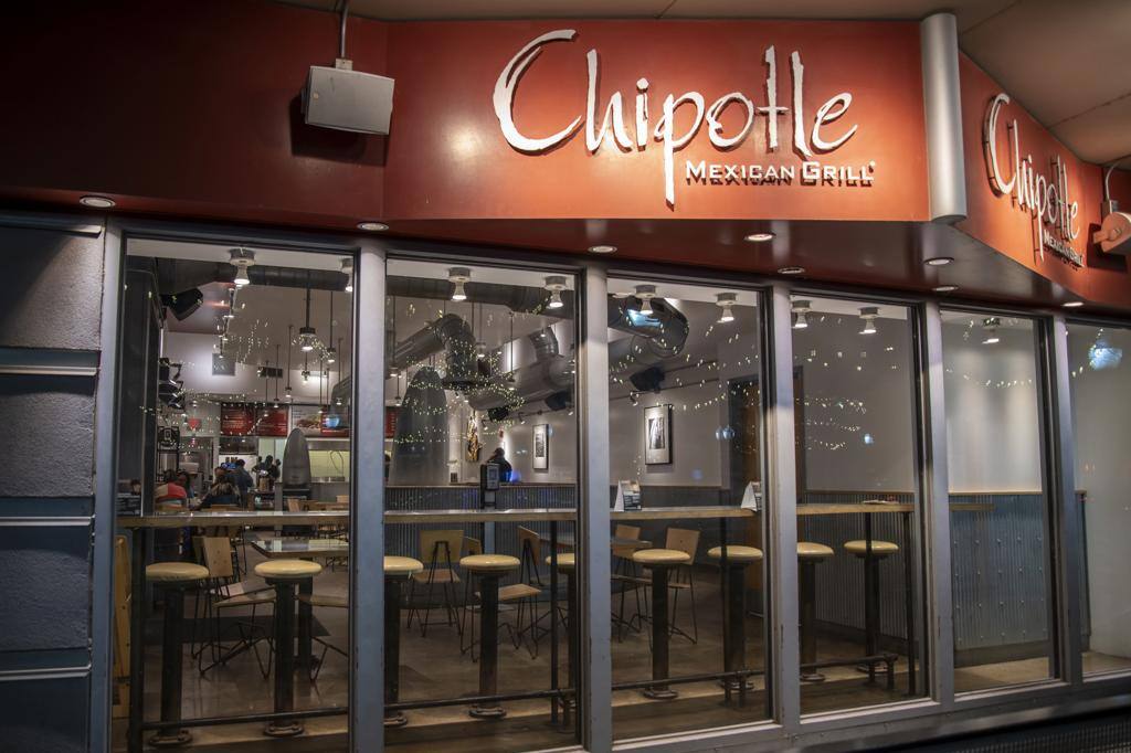 CHIPOTLE MEXICAN GRILL ON MAIN STREET AT NIGHT