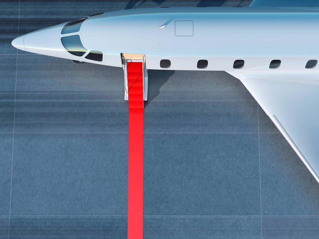 RED CARPET LEADING TO A BUSINESS JET ENTRANCE