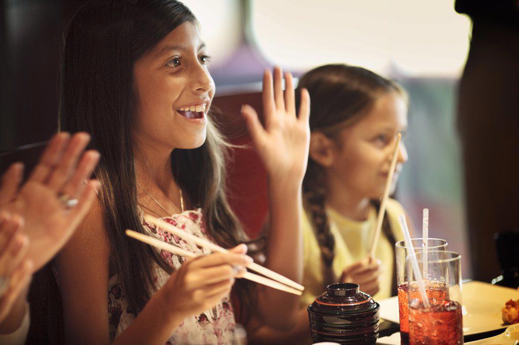 TWO SISTERS AT A TEPPENYAKI RESTAURANT