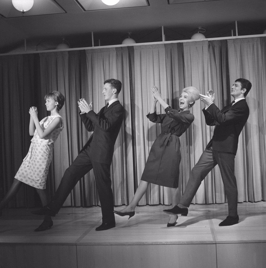 DANCING IN THE 1960S. THE DANCE HULLY GULLY IS BEING MADE POPULAR AND HERE ARE MEN AND WOMEN DANCING THE NEW CRAZE.