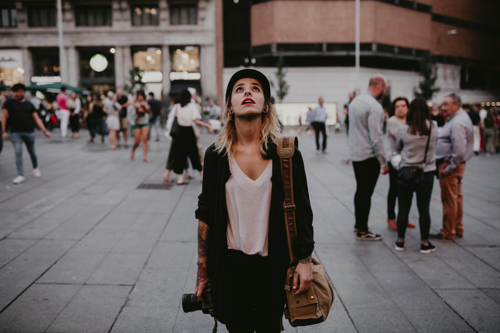 WOMAN WITH CAMERA SIGHTSEEING