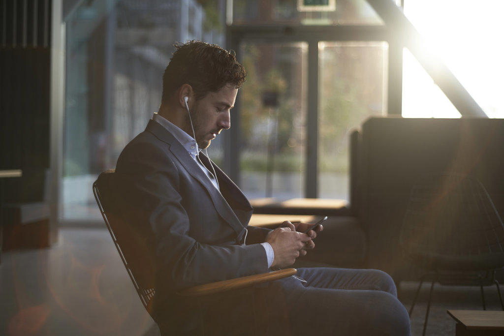 MAN WEARING A SUIT WAITING FOR HIS JOB INTERVIEW