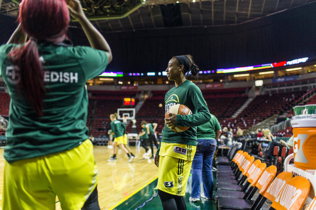 Female basketball players warming up before game