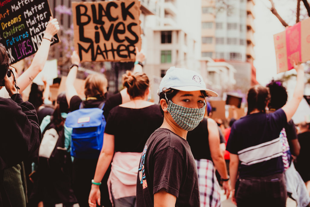 PRE-TEEN BOY WALKING AT A BLACK LIVES MATTER MARCH